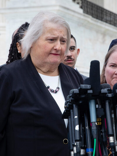 Aimee Stephens speaks with reporters outside the Supreme Court.