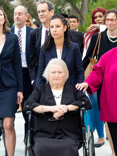 Aimee Stephens with her wife and legal team outside the Supreme Court.