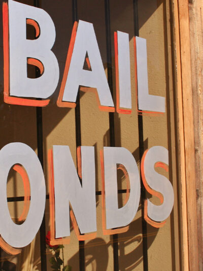 Window sign reads "bail bonds"
