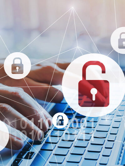 Person typing on a laptop, depicting data breach with animation of open lock over image.