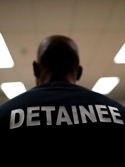 A detainee sits at the Otay Mesa Detention Center in San Diego.