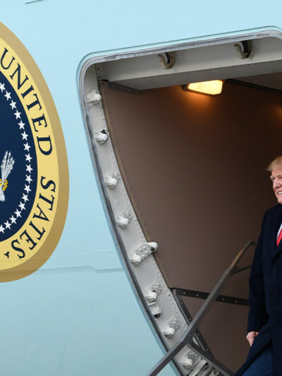 President Donald Trump walks down the steps of Air Force One at Andrews Air Force Base in Maryland.