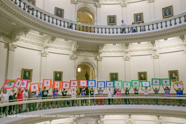 Representatives of the Trust, Respect, Access Coalition, holding multicolored signs spelling out ABORTION=HEALTHCARE, gathered in the Texas Capitol Rotunda Thursday afternoon July 27, 2017 to voice their opposition to abortion legislation being...