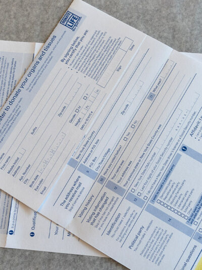 Photo from above of New York State Voter registration forms
