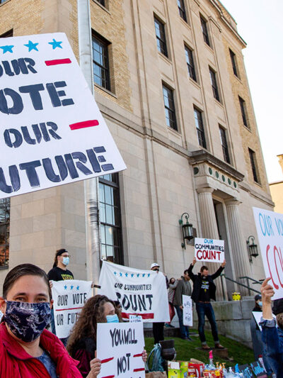 Dozens of people gathered near the Post Office in Lewisburg, Pennsylvania, holding signs that read "Our Vote Our Future" and "Our Voices Count," to celebrate the election of Joe Biden.