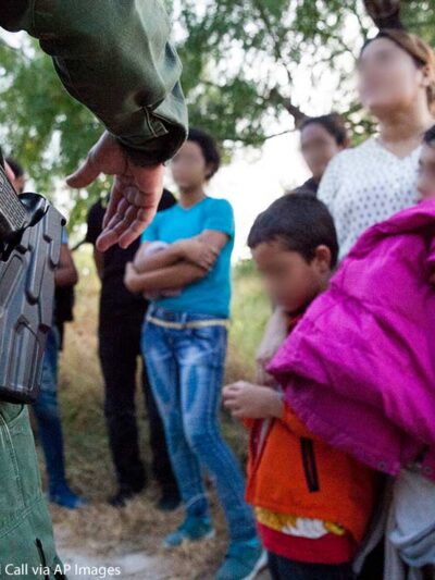 A Customs and Border Protection officer questions immigrants in Rio Grande Valley sector of the Texas border on Aug. 20, 2019.