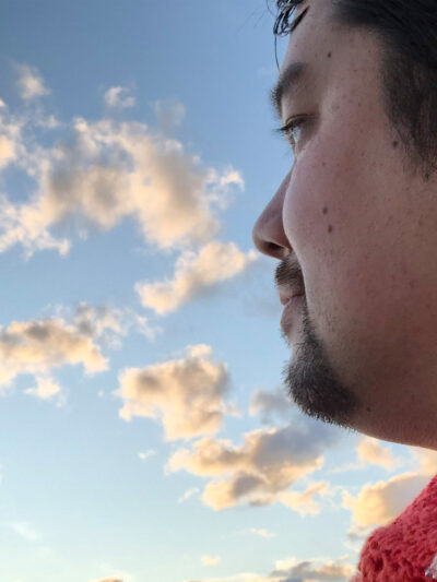 Shige Sakurai with the sky in the background.