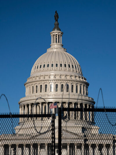 Black fence in front of Capitol building in Washington, DC.