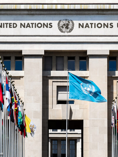 National flags at the entrance of the UN office in Geneva, Switzerland.