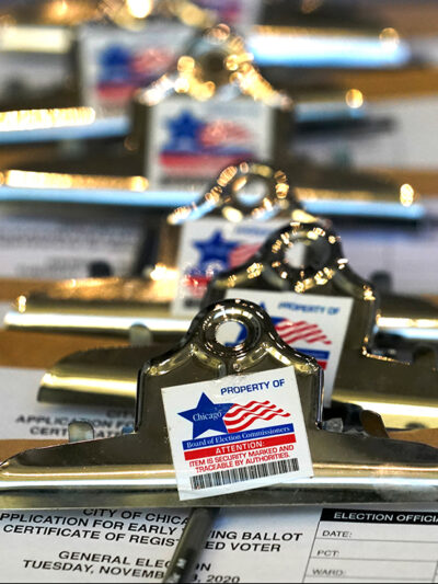 Clipboards with voter registration forms.