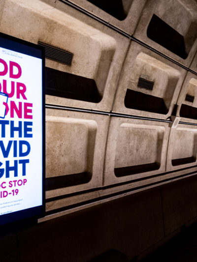 An electronic ad inside DC's Metro Station for the the DC Department of Health's mobile Covid-19 contact tracing app.