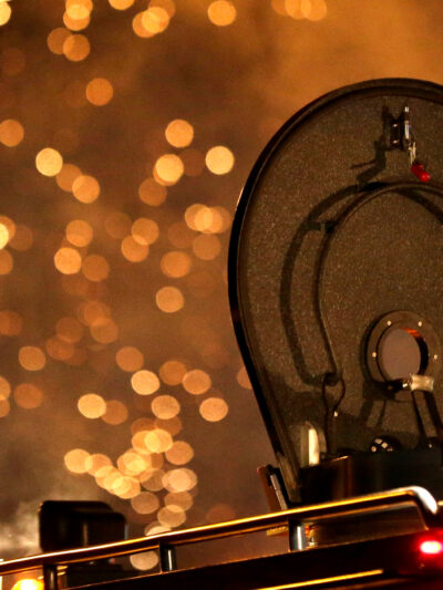 A law enforcement officer watches from an armored vehicle after a device was fired to disperse a crowd during a protest.