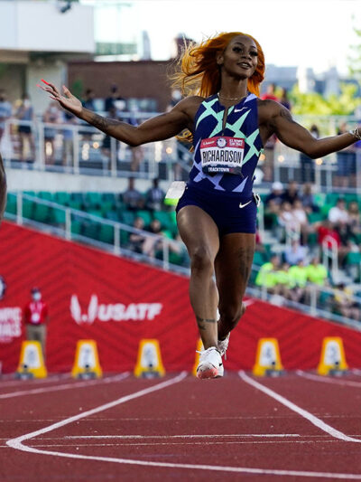Sha'Carri Richardson celebrates after winning during fourth heat at Olympics 2021