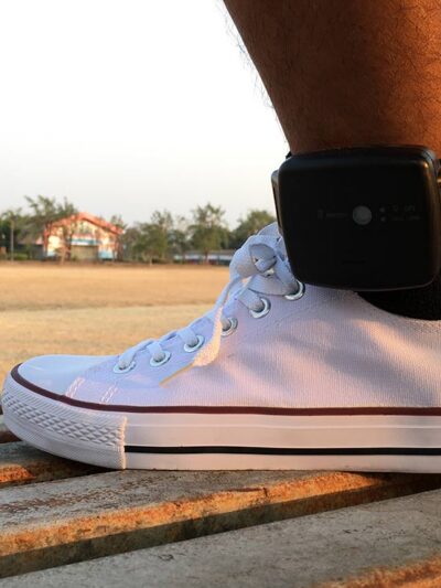 Male prisoner attached to an Electronic Monitoring (EM) ankle monitor