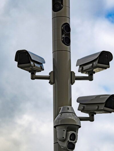 Surveillance cameras on a street pole.