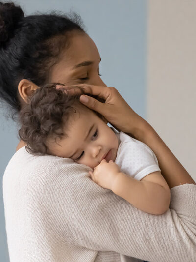 A mother holding her infant.