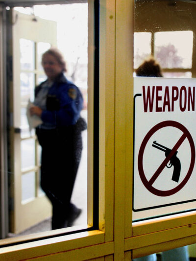 A sign at the entrance of the city hall in Anchorage, Alaska, that warns handgun owners that guns are prohibited in the building.