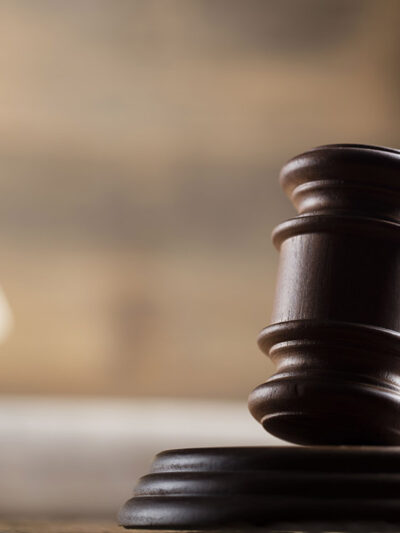 A gavel in a courtroom setting.