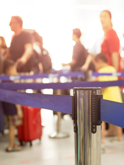 People waiting in line at an airport.