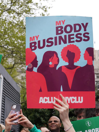 A protest sign that reads “My Body, My Business.”