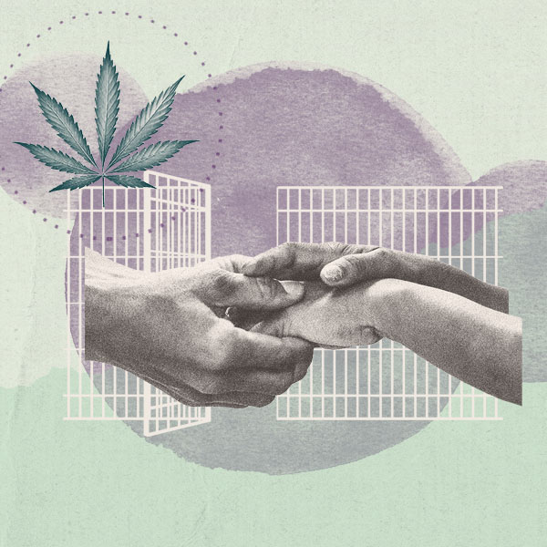 Hands clasped in front of open prison doors