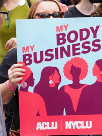 ACLU supporters marching at a reproductive rights rally.