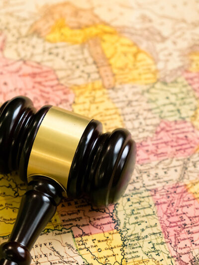 A map of the United States with a gavel on it.
