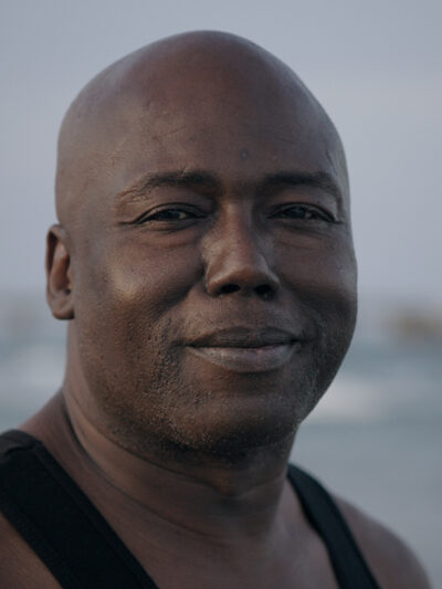 Herman Lindsey confidently smiling.