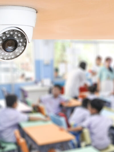 A classroom cctv camera keeping watch over students.