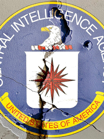 CIA logo on cracked wall.
