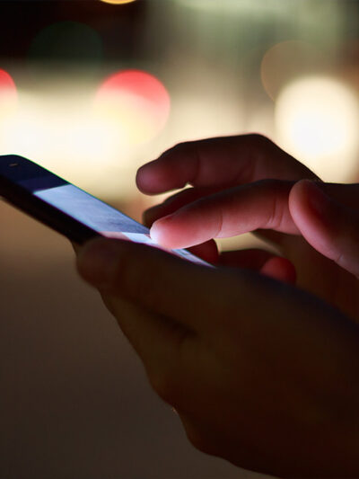 A photo of a someone scrolling on a smartphone.