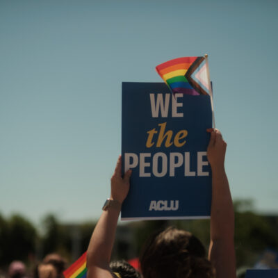 We the People with a rainbow flag
