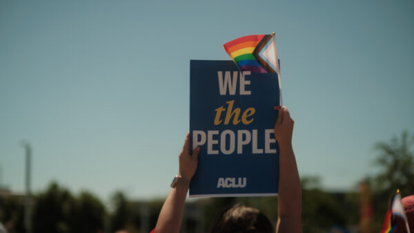 We the People with a rainbow flag