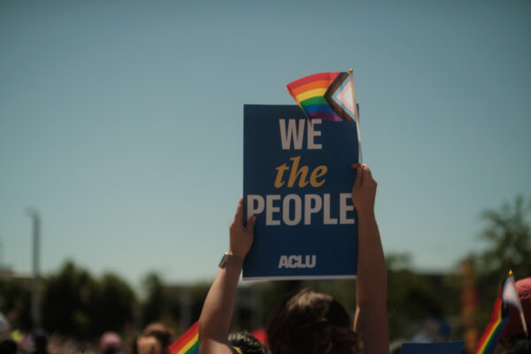 We the People with a rainbow flag