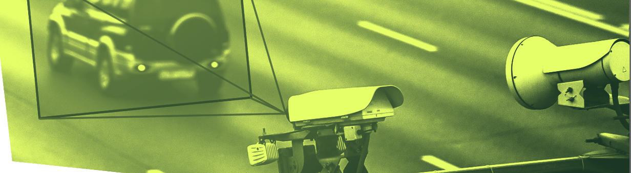 Green and black image with cameras focused on a license plate.