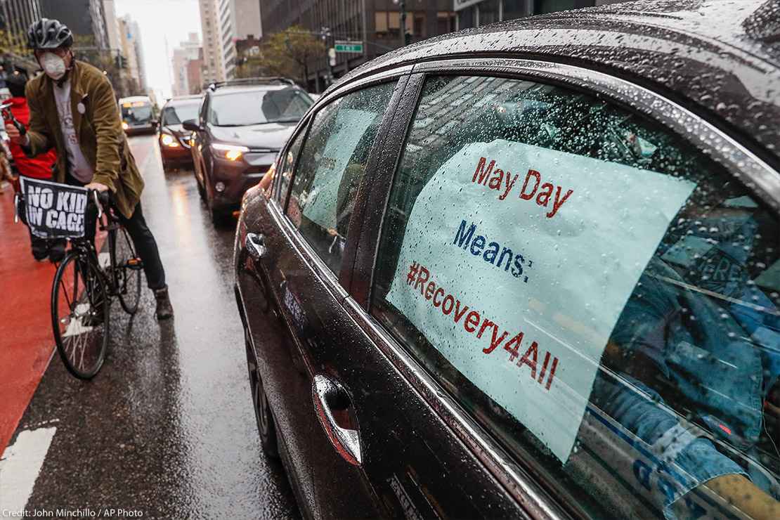 A caravan of May Day protestors drive up 2nd Avenue in New York City during COVID pandemic.