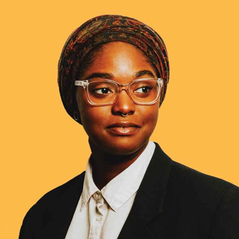 Yellow background, headshot of Representative Mauree Turner