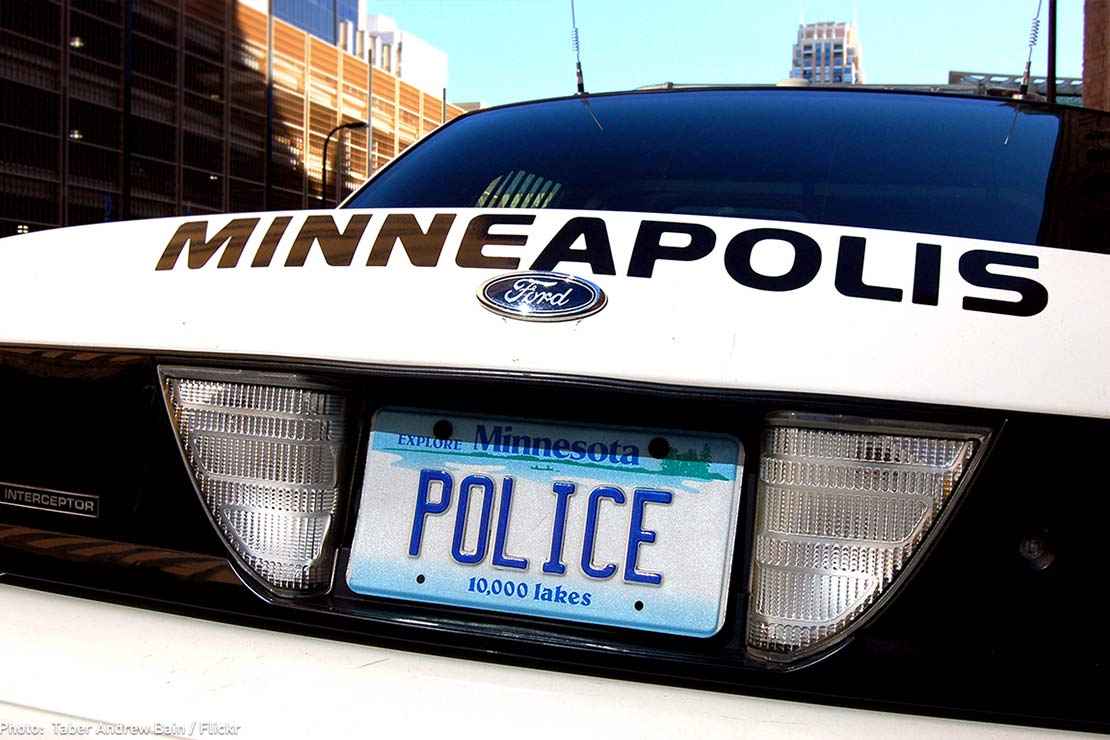 A Minneapolis, MN, police car rear license plate is shown that says "POLICE"