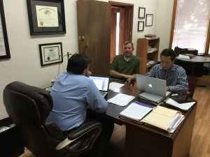 ACLU Legal Director Brady Henderson, left, meets with attorneys Greg Beben, center and Joseph Thai, right, as they prepare a federal lawsuit against Oklahoma City