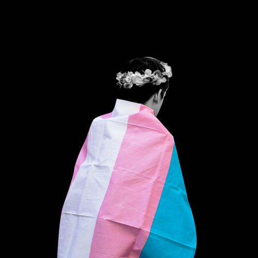 youth wearing a transgender flag