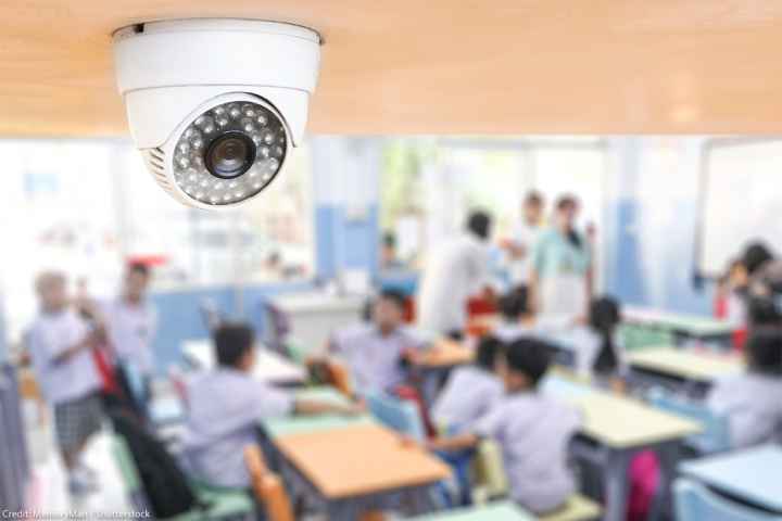 A classroom cctv camera keeping watch over students.