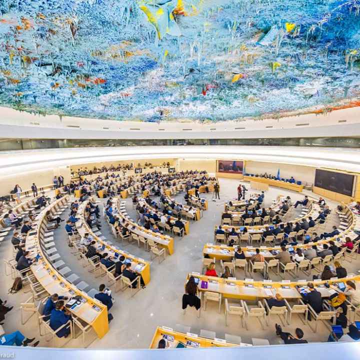 Delegates, arrayed in an expanding circle of desks, attend the 50th session of the Human Rights Council, at the European headquarters of the United Nations in Geneva, Switzerland.