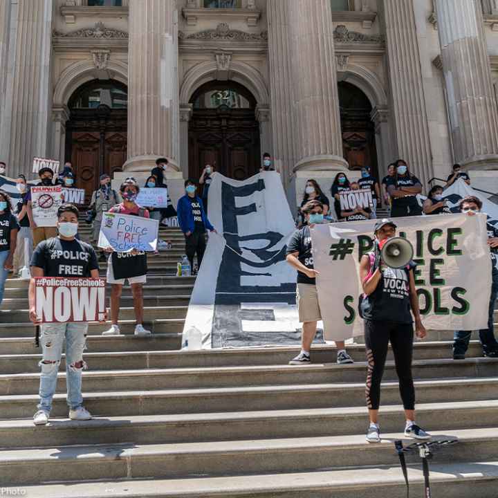 Protesters demanding removing police officers from schools on steps of Department of Education in Manhattan, New York.