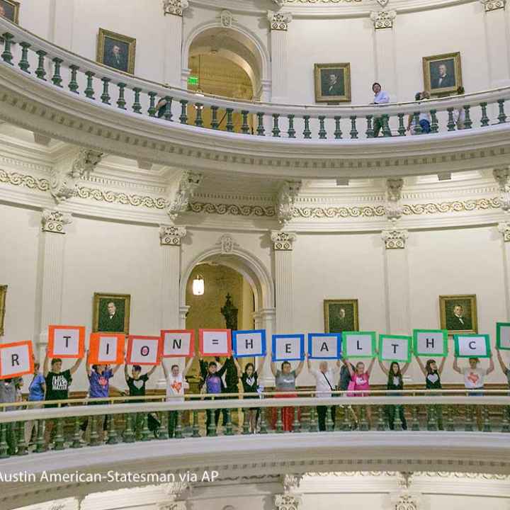 Representatives of the Trust, Respect, Access Coalition, holding multicolored signs spelling out ABORTION=HEALTHCARE, gathered in the Texas Capitol Rotunda Thursday afternoon July 27, 2017 to voice their opposition to abortion legislation being...