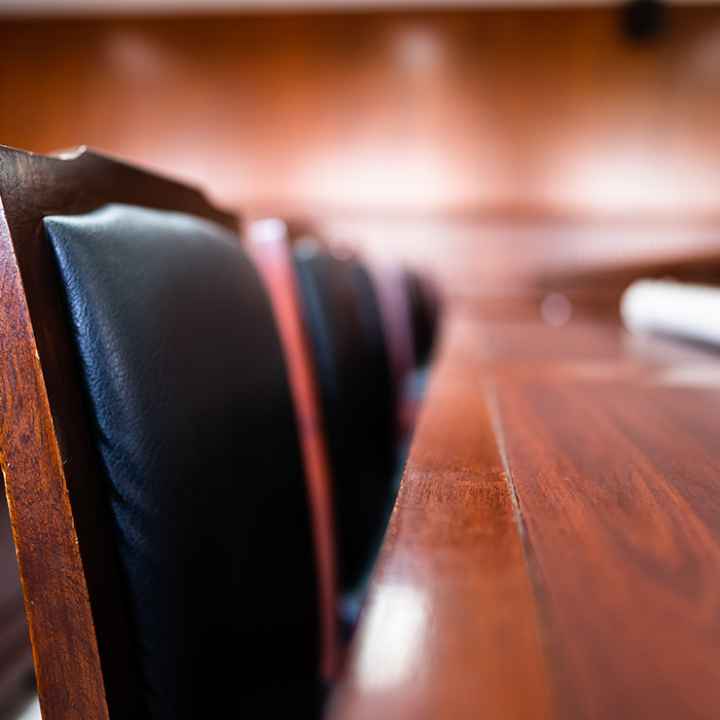 A close up image of a series of jury seats.